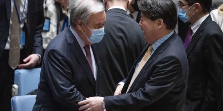 Hayashi Yoshimasa, Minister for Foreign Affairs of Japan, right, arrives with United Nations Secretary General Antonio Guterres before chairing a Security Council meeting at United Nations headquarters, Thursday, Jan. 12, 2023. (AP Photo/John Minchillo)