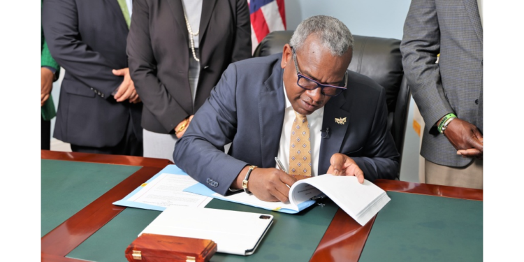 Governor Albert Bryan signing the Virgin Islands Cannabis Use Act today. Photo: Government House