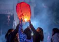 People release a sky lantern to make a wish for good fortune at a park in Qianxi, southwest China's Guizhou Province, on January 1 (XINHUA)