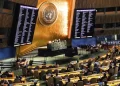 FILE - Video monitors show member nation vote in the United Nations General Assembly in favor of a resolution condemning Russia's illegal referendum in Ukraine, on Oct. 12, 2022 at U.N. headquarters. Ukraine’s supporters have circulated a proposed resolution for adoption by the 193-member U.N. General Assembly on the eve of the first anniversary of Russia’s invasion of its smaller neighbor. The proposed resolution, obtained Friday, Feb. 10, 2023, by The Associated Press, is broader and less detailed than Ukrainian President Volodymyr Zelenskyy's 10-point peace plan. (AP Photo/Bebeto Matthews, File)