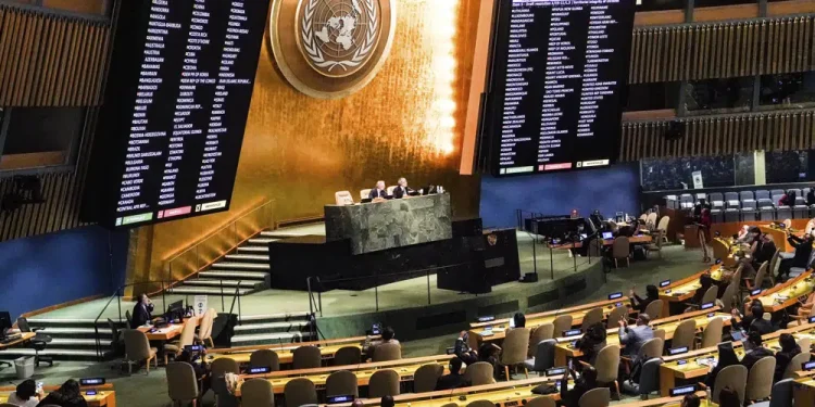 FILE - Video monitors show member nation vote in the United Nations General Assembly in favor of a resolution condemning Russia's illegal referendum in Ukraine, on Oct. 12, 2022 at U.N. headquarters. Ukraine’s supporters have circulated a proposed resolution for adoption by the 193-member U.N. General Assembly on the eve of the first anniversary of Russia’s invasion of its smaller neighbor. The proposed resolution, obtained Friday, Feb. 10, 2023, by The Associated Press, is broader and less detailed than Ukrainian President Volodymyr Zelenskyy's 10-point peace plan. (AP Photo/Bebeto Matthews, File)