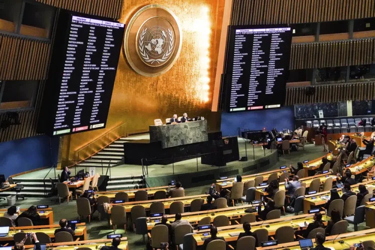 FILE - Video monitors show member nation vote in the United Nations General Assembly in favor of a resolution condemning Russia's illegal referendum in Ukraine, on Oct. 12, 2022 at U.N. headquarters. Ukraine’s supporters have circulated a proposed resolution for adoption by the 193-member U.N. General Assembly on the eve of the first anniversary of Russia’s invasion of its smaller neighbor. The proposed resolution, obtained Friday, Feb. 10, 2023, by The Associated Press, is broader and less detailed than Ukrainian President Volodymyr Zelenskyy's 10-point peace plan. (AP Photo/Bebeto Matthews, File)