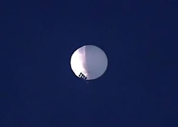 A high altitude balloon, which U.S. officials have speculated as a spy balloon from China, floats over Billings, Mont., on Wednesday, Feb. 1, 2023. Another balloon was detected over Latin America on Friday evening. (Larry Mayer/The Billings Gazette via AP)