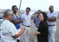 The head of the United Nations Office for Disaster Risk Reduction (UNDRR), Mami Mizutori interacting with persons affected by disasters in recent years in Sandy Bay. (CMC Photo)