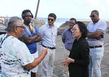 The head of the United Nations Office for Disaster Risk Reduction (UNDRR), Mami Mizutori interacting with persons affected by disasters in recent years in Sandy Bay. (CMC Photo)