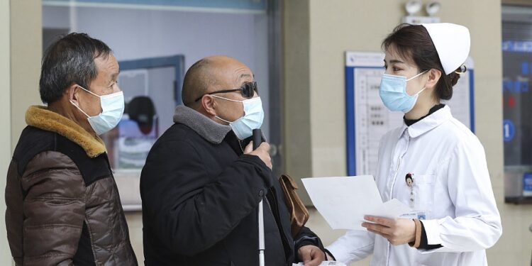 A nurse helps patients in Huai'an, east China's Jiangsu Province, February 12, 2023. /CFP