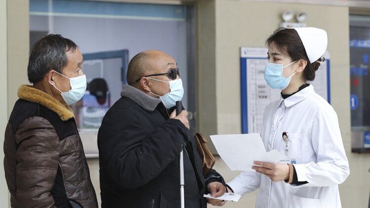A nurse helps patients in Huai'an, east China's Jiangsu Province, February 12, 2023. /CFP