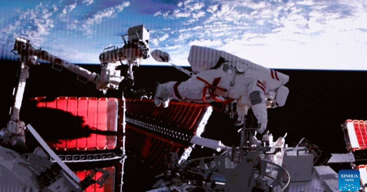 This screen image captured at Beijing Aerospace Control Center on February 9 shows Shenzhou-15 taikonaut Fei Junlong returning to space station lab module Wentian with equipment.The Shenzhou-15 taikonauts on board the orbiting Chinese Tiangong space station completed their first spacewalk at 12:16 a.m. (Beijing Time) on February 10, according to the China Manned Space Agency (XINHUA)