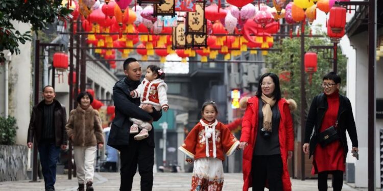 Tourists have fun in Qianyuan town of Deqing county, Huzhou, East China's Zhejiang province, Jan 22, 2023. [Photo/Xinhua]