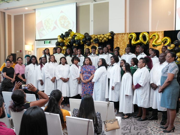 The Honourable Minister of Education, Priya Manickchand pose for a photograph with the Carnegie School of Home Economics’ Class of 2022 along with other senior officials