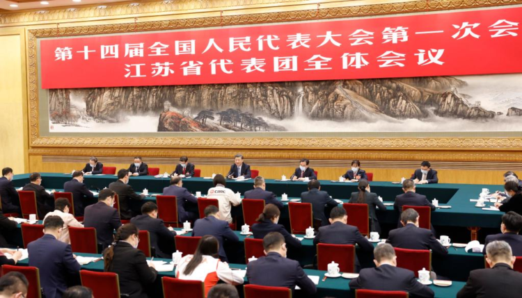 Chinese President Xi Jinping, also general secretary of the Communist Party of China Central Committee and chairman of the Central Military Commission, takes part in a deliberation with his fellow deputies from the delegation of Jiangsu Province, at the first session of the 14th National People's Congress (NPC) in Beijing, capital of China, March 5, 2023. (Xinhua/Huang Jingwen)