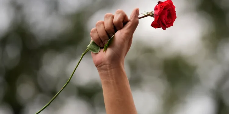 A protester in Manila, Philippines marks International Women's Day [Aaron Favila/AP Photo]