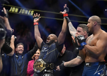 Jon Jones, center, celebrates after defeating Ciryl Gane in a UFC 285 mixed martial arts heavyweight title bout Saturday, March 4, 2023, in Las Vegas. (AP Photo/David Becker)