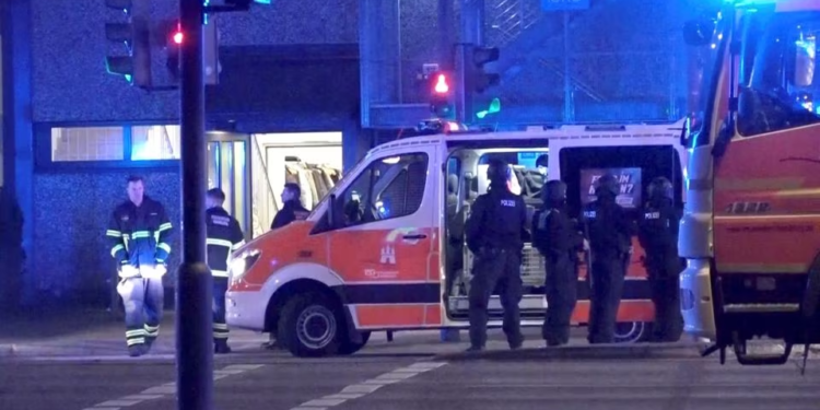 [1/7] Emergency workers and police gather at the scene following a deadly shooting in Hamburg, Germany, March 9, 2023 in this still image taken from video. NONSTOP NEWS via Reuters TV/Handout via REUTERS