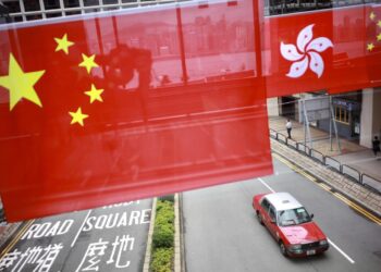 China's national flag and the flag of the Hong Kong Special Administrative Region are hung over the street for the celebration of 24th anniversary of Hong Kong's return to the motherland at Tsim Sha Tsui East in Hong Kong on June 29, 2021. [Photo by Edmond Tang/chinadaily.com.cn]