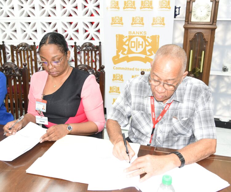 In photo Dr. Renita Crandon Duncan (GTI Principal) and Mr. Andrew Carto (Human Resources Executive Banks DIH Limited)