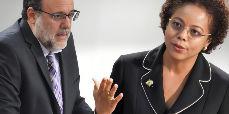 Opposition Leader and PNP President Mark Golding (l). Legal and Constitutional Affairs Minister Marlene, Malahoo-Forte