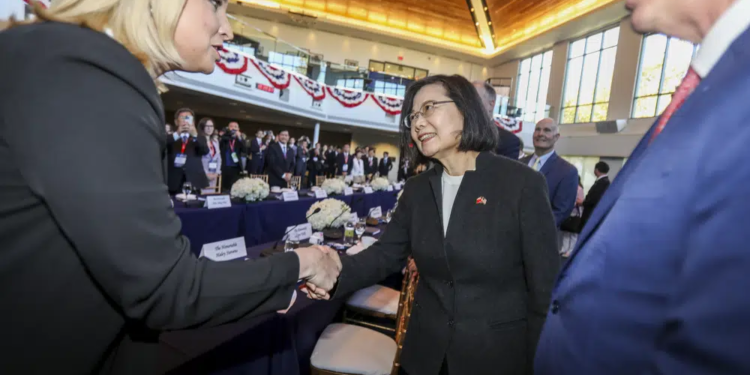 FILE- Taiwan President Tsai Ing-wen, center, is greeted before a Bipartisan Leadership Meeting at the Ronald Reagan Presidential Library in Simi Valley, Calif., on April 5, 2023. China is imposing sanctions against the Ronald Reagan Presidential Library and other U.S.- and Asian-based organizations in retaliation for the closely watched meeting this week between the U.S. House Speaker and Taiwan’s president. (AP Photo/Ringo H.W. Chiu, File)