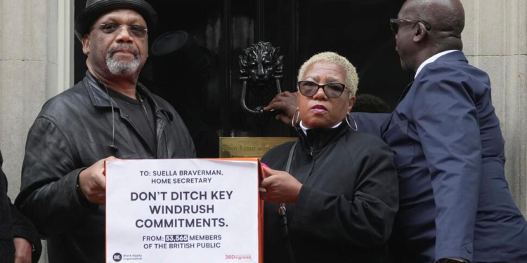 From left, Windrush campaigners, Auckland Elwaldo Romeo, Glenda Caesar and Patrick Vernon hand in a letter to Downing Street, Thursday April, 6, 2023. The Black Equity Organisation submitted a petition signed by more than 50,000 people that criticised the “painfully slow” response to the scathing 2018 report and the decision by Home Secretary Suella Braverman to scrap several recommendations her predecessor accepted. “We urge your government to stick to the promises made — there is still an opportunity to show that you and your ministers are serious about righting past wrongs," a letter to Sunak said. (AP Photo/Kin Cheung)
