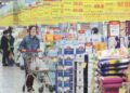 People shop at a supermarket in Nanjing, east China's Jiangsu Province, April 11, 2023. (Photo by Su Yang/Xinhua)