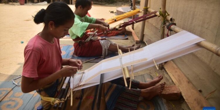 Women weave Jamborong (traditional bag) in Karbi Anglong district of India's northeastern state of Assam, March 12, 2023.(Photo: Xinhua)