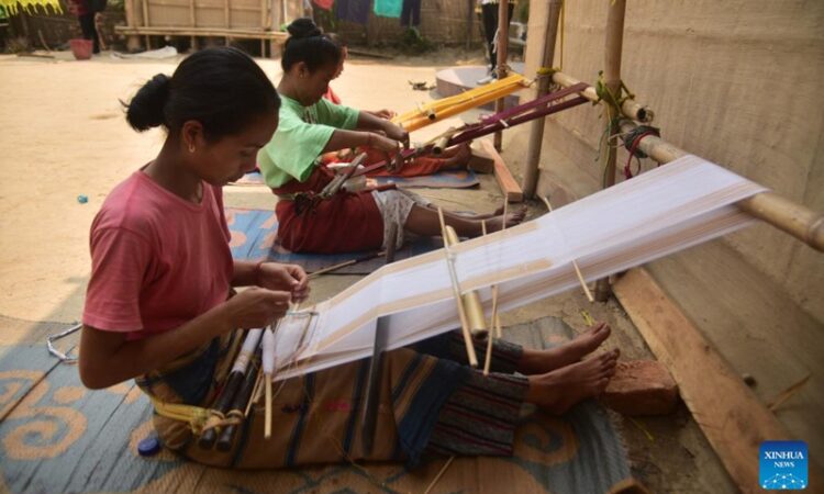 Women weave Jamborong (traditional bag) in Karbi Anglong district of India's northeastern state of Assam, March 12, 2023.(Photo: Xinhua)