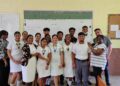 Zeeburg Secondary School’s acting Head of Department for Business, Ms Anella Bissessar with the students at the Belmopan Comprehensive High School