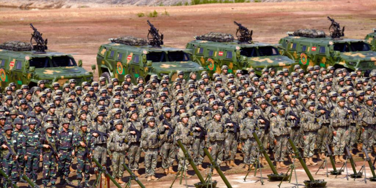 Soldiers attend the launching ceremony of the China-Laos Friendship Shield-2023 joint exercise in Laos, May 11, 2023. China and Laos launched a joint military exercise on Thursday at the Kommadam Academy of the Lao People's Armed Forces (LPAF) in Laos, aimed at enhancing capabilities of the two militaries to combat terrorism. (Photo by Yang Jicheng/Xinhua)