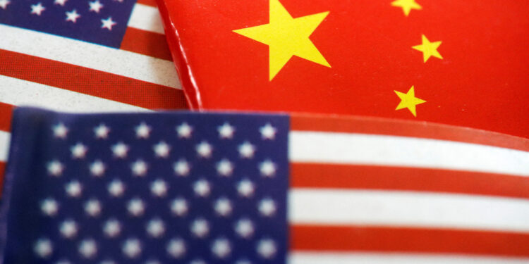 FILE PHOTO: Flags of U.S. and China are seen in this illustration picture taken August 2, 2022. REUTERS/Florence Lo/Illustration