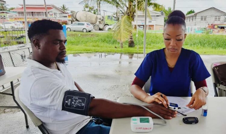Staff of GWI being attended to by Nurse Trevlind