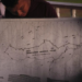 Orin Fernandes, a toshao, or Indigenous leader, holds a map of Chinese Landing's Amerindian territory, in Chinese Landing, Guyana, Monday, April 17, 2023. Chinese Landing secured its land title in 1976. (AP Photo/Matias Delacroix)