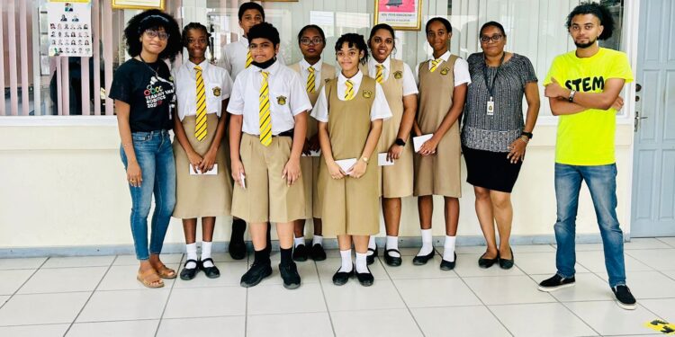 Members of the Queens College STEM club, team mentor Ms Diane Henery and STEMGuyana Representatives Ms Alisha Koulen and Mr Dominic Budhan