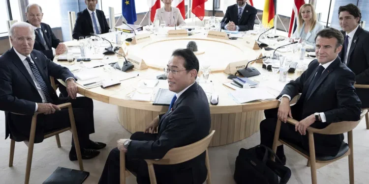 ILE - Clockwise from left, U.S. President Joe Biden, Germany's Chancellor Olaf Scholz, Britain's Prime Minister Rishi Sunak, European Commission President Ursula von der Leyen, President of the European Council Charles Michel, Italy's Premier Giorgia Meloni, Canada's Prime Minister Justin Trudeau, France's President Emmanuel Macron and Japan's Prime Minister Fumio Kishida attend a meeting during the G7 Leaders' Summit in Hiroshima, western Japan Friday, May 19, 2023. The Group of Seven advanced economies are expected to announce a new set of sanctions against Russia to try to further hinder its war effort in Ukraine during their summit in Hiroshima, Japan. (Brendan Smialowski/Pool Photo via AP, File)