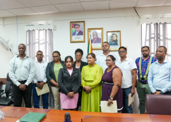 DSC06136: The Honourable Minister of Education, Priya Manickchand, Permanent Secretary, Mr. Alfred King (left), Special Projects Officer, Mr. Ron Eastman (right) along with representatives of the contracting firms pose for a photograph following the signing of the contracts.