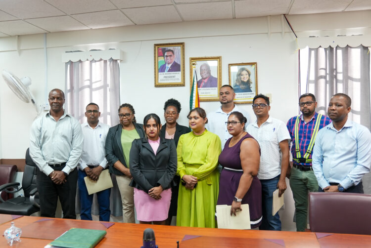 DSC06136: The Honourable Minister of Education, Priya Manickchand, Permanent Secretary, Mr. Alfred King (left), Special Projects Officer, Mr. Ron Eastman (right) along with representatives of the contracting firms pose for a photograph following the signing of the contracts.
