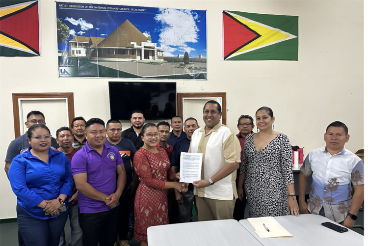 Iwokrama’s CEO, Dane Gobin and Vice Chairwoman of the NTC, Sonia Latchman after the signing of the MOU. Looking on (2nd from right) is Dr Raquel Thomas, Director of Resource Management and Training at Iwokrama together with Executive Members and administrative staff from the NTC.