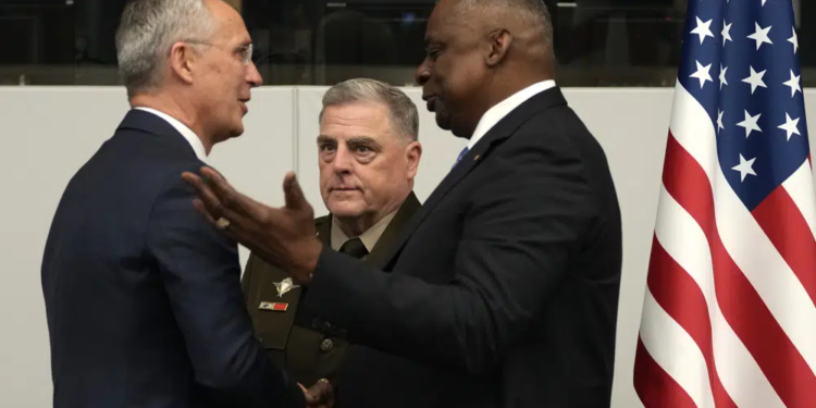 United States Secretary of Defense Lloyd Austin, right, greets NATO Secretary General Jens Stoltenberg, left, during a meeting of the Ukraine Defense Contact Group at NATO headquarters in Brussels, Thursday, June 15, 2023. NATO defense ministers are holding two days of meetings to discuss their support for Ukraine and ways to boost the defenses of eastern flank allies near Russia. A meeting of the Ukraine Contact Group is being held to drum up more military aid for the war-torn country. (AP Photo/Virginia Mayo)