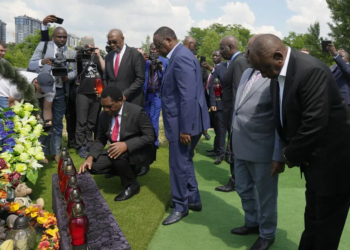 From right, South African President Cyril Ramaphosa, President of the Union of Comoros Azali Assoumani, Senegal's President Macky Sall, and Zambia's President Hakainde Hichilema, bottom, attend a commemoration ceremony at a site of a mass grave in Bucha, on the outskirts of Kyiv, Ukraine, Friday, June 16, 2023. South African President Cyril Ramaphosa arrived in Ukraine on Friday as part of a delegation of African leaders and senior officials seeking ways to end Kyiv's 15-month war with Russia. (AP Photo/Efrem Lukatsky).