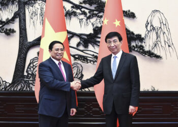 Wang Huning, chairman of the National Committee of the Chinese People's Political Consultative Conference, or CPPCC, meets Pham Minh Chinh, a member of the Political Bureau of the Central Committee of the Communist Party of Vietnam, and Prime Minister of Vietnam, in Beijing. [Photo/Xinhua]