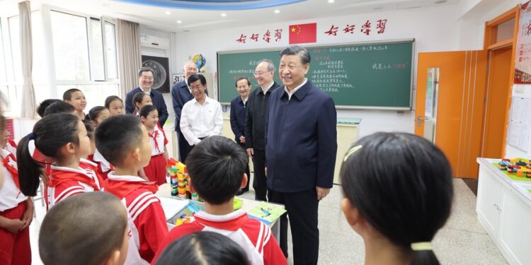 Chinese President Xi Jinping, also general secretary of the Communist Party of China Central Committee and chairman of the Central Military Commission, talks with students at a science classroom of Beijing Yuying School in Beijing, capital of China, May 31, 2023. Xi on Wednesday visited Beijing Yuying School and extended festival greetings to children across the country ahead of International Children's Day, which falls on June 1. (Xinhua/Wang Ye)