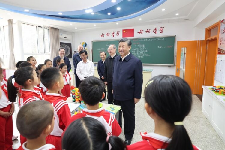 Chinese President Xi Jinping, also general secretary of the Communist Party of China Central Committee and chairman of the Central Military Commission, talks with students at a science classroom of Beijing Yuying School in Beijing, capital of China, May 31, 2023. Xi on Wednesday visited Beijing Yuying School and extended festival greetings to children across the country ahead of International Children's Day, which falls on June 1. (Xinhua/Wang Ye)
