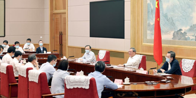 Chinese Premier Li Qiang, also a member of the Standing Committee of the Political Bureau of the Communist Party of China Central Committee, holds a symposium on the economic situation, listening to opinions and suggestions from experts and scholars on the country's economy and work, in Beijing, capital of China, July 6, 2023. Vice-Premier Ding Xuexiang, also a member of the Standing Committee of the Political Bureau of the CPC Central Committee, attended the meeting. [Photo/Xinhua]