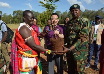 Food and Agriculture Organization of the United Nations (FAO) Director-General Qu Dongyu (C, Front) prepares to plant a medicinal seedling during a tour of Karura forest on the outskirts of Nairobi, Kenya, on Feb. 19, 2023. (Photo by Charles Onyango/Xinhua)
