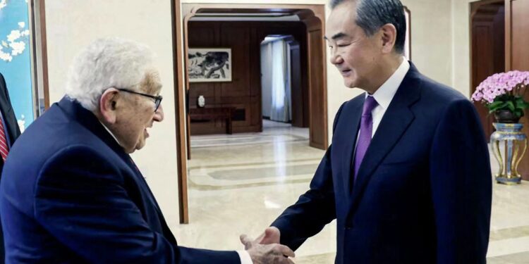 Wang Yi, director of the Office of the Foreign Affairs Commission of the Communist Party of China (CPC) Central Committee, shakes hands with visiting centenarian former US secretary of state Henry Kissinger as they meet in Beijing on July 19, 2023. Photo: AFP