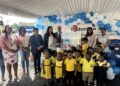 UNICEF Area Representatives, Nicolas Pron and Irfan Aktar, Minister of Human Services and Social Security, Dr. Vindhya Persaud, High Commissioner of Canada to Guyana, His Excellency Mark Berman, other members of the MOHSS and students of the Lovable Friends and Kiskadee Daycare centres pose for a photo with one of the ECD kits