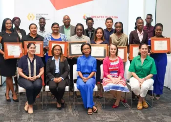 Minister of Tourism, Industry and Commerce, Oneidge Walrond along with the participants and other officials