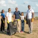 Director General of MARAD, Stephen Thomas, and a family who joined in the cleaning exercise