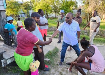 Former Mayor Pt Ubraj Narine (2nd left), Roysdale Forde SC MP (shaking hand) and members of the community.