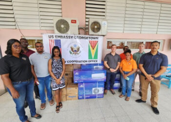 U.S. Embassy representatives present air conditioning units to Linden Hospital