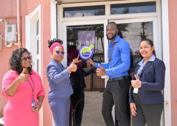(L-R) QualiTEST Medical Director Dr. Harsha Mohan, Scientific Laboratory Director Ms. Yvette Irving, GNBS Technical Officers Mr. Orlando Sturge and Rosmarie Liliah photographed after affixing the Certification sticker.